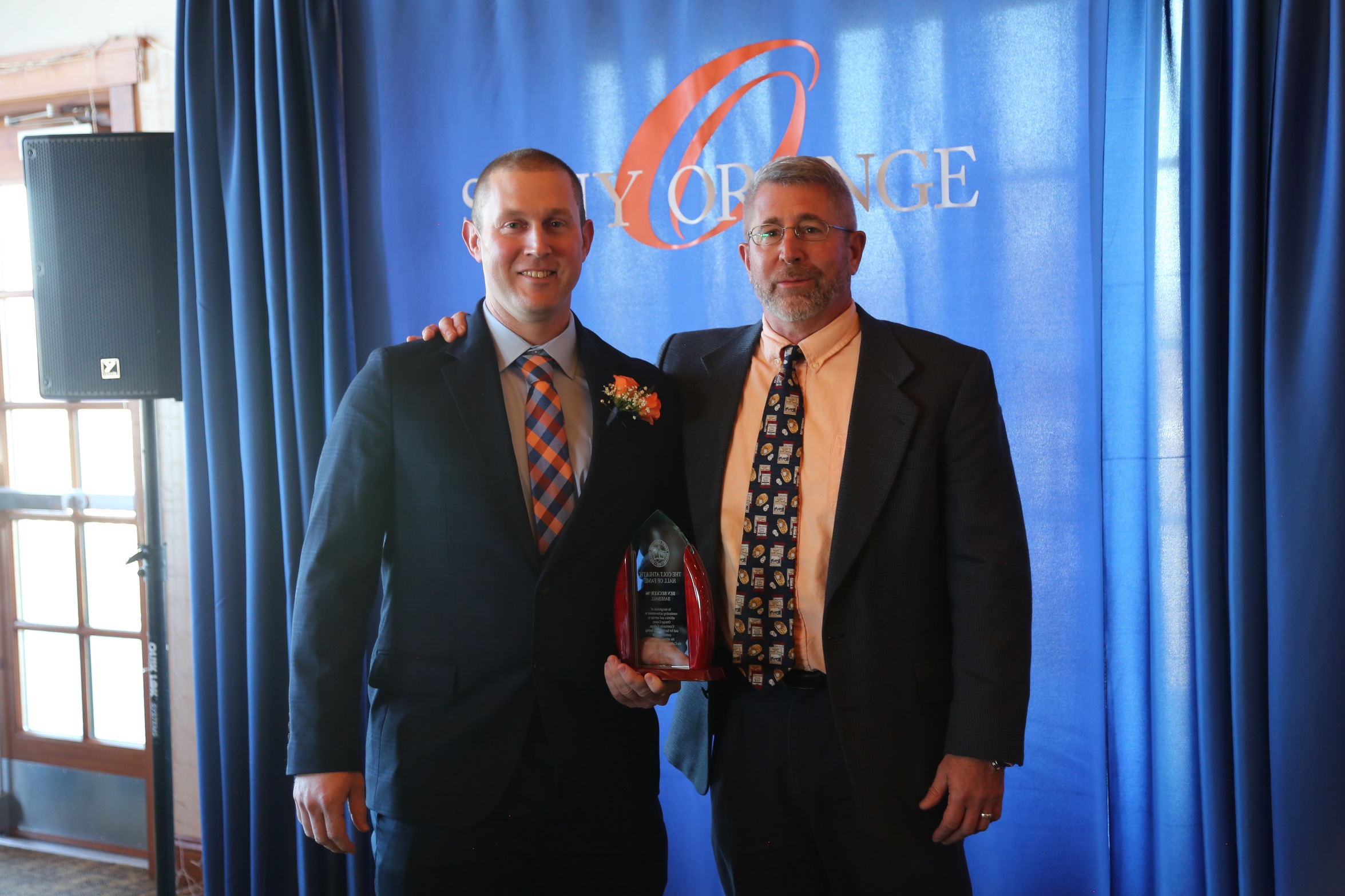 Ben Becker receiving award from former coach Wayne Smith